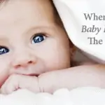 When should baby first visit the dentist - photo of baby in blanket