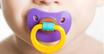 photo of pacifier in baby's mouth