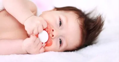 baby with pacifier in mouth