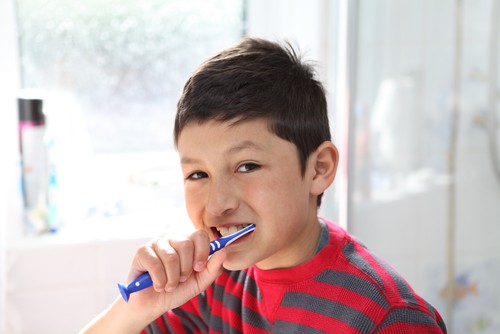 boy brushing teeth
