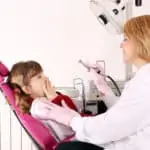 little girl scared in dental chair